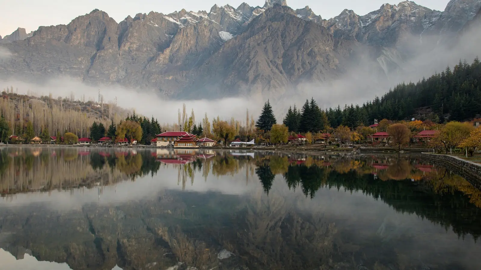 Shangrila Lower Kachura Lake with red-roofed huts and mountain reflections near Skardu, Pakistan